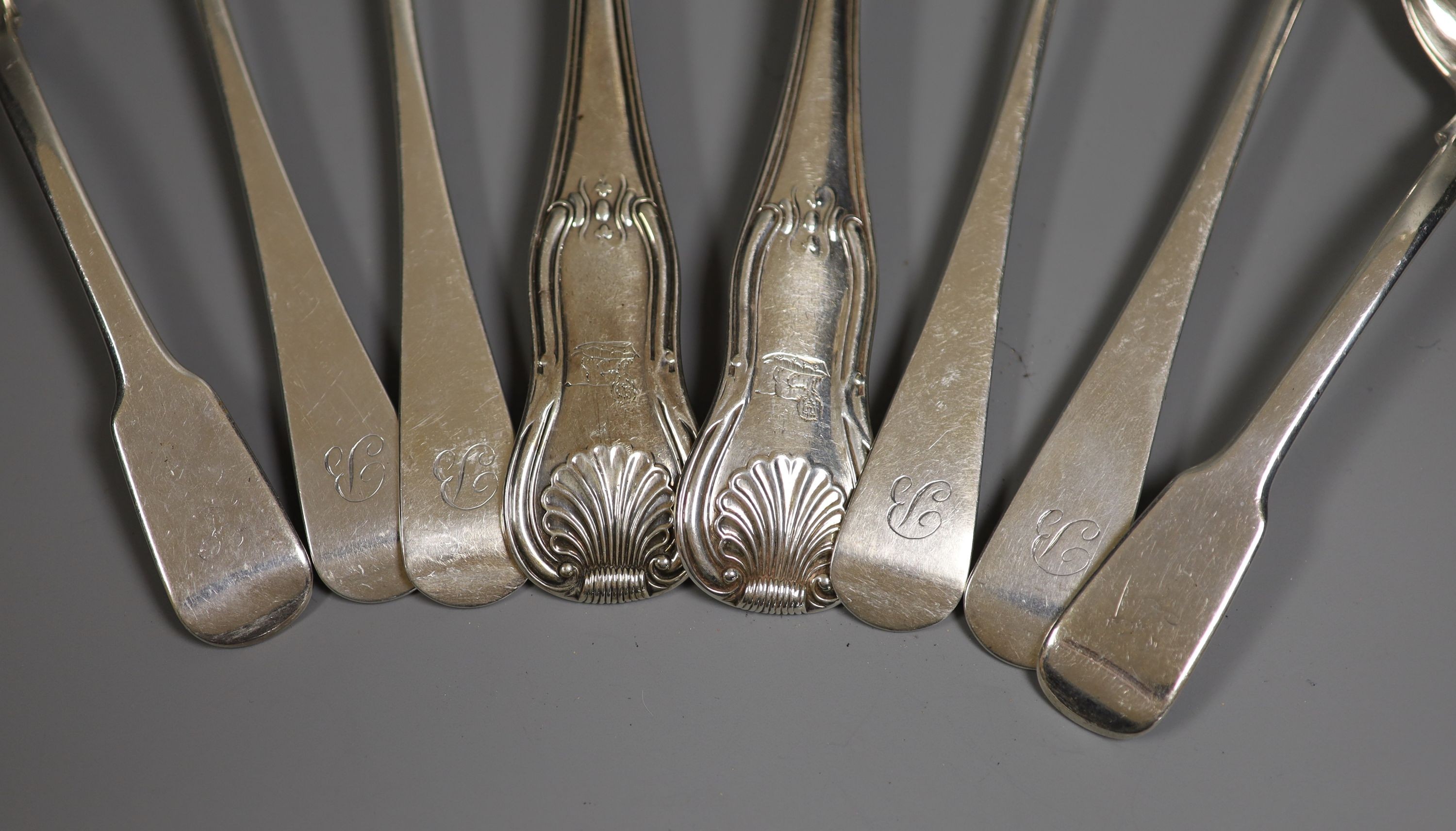 A pair of George III silver hourglass pattern basting spoons, London, 1812, a pair of silver sauce ladles and four Victorian silver tablespoons, 22.5oz.